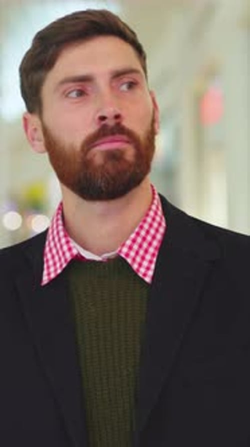 A Stylish Man With a WellGroomed Beard Posed Elegantly in a Contemporary Setting or Environment