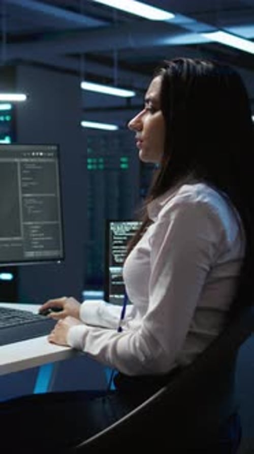 Vertical Video Team of Technicians in Data Center Managing Infrastructure