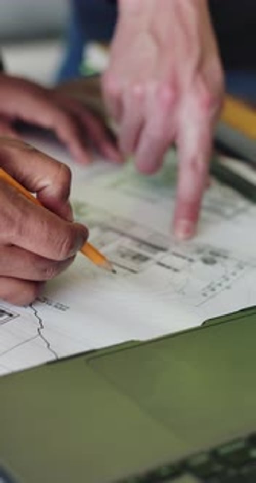Hands, engineer and writing with team for blueprint, review or real estate development