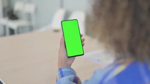 Close Up of Young African Woman Using Phone with Green Screen