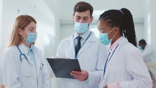 Medical Professionals Discussing Patient Care in Hospital Setting