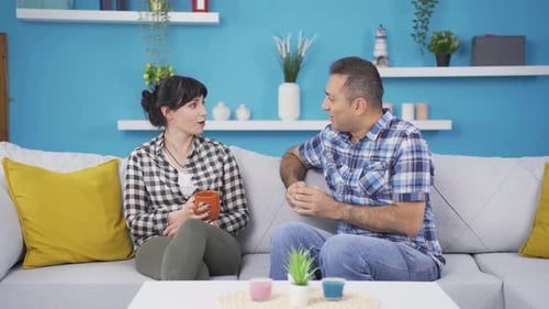 Couple Chatting on Couch in Cozy Home