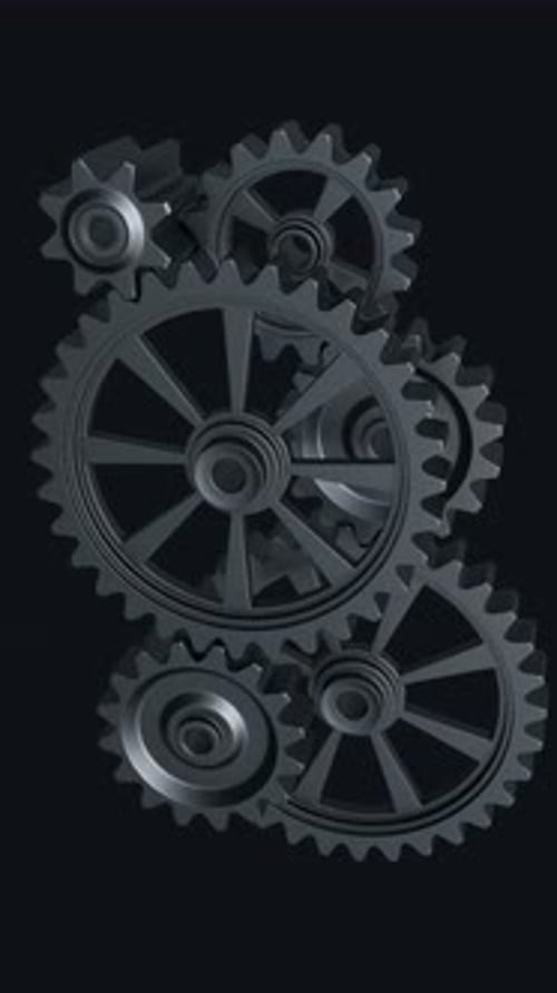 Intricate Array of Rotating Interlocking Metal Gears in CloseUp View