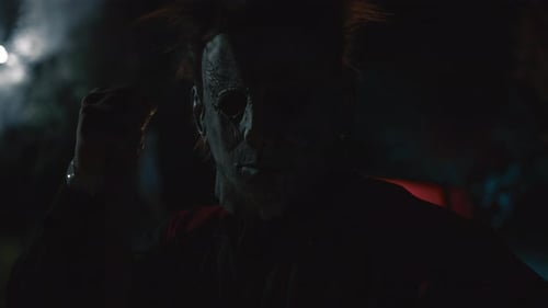 Menacing Masked Figure Lit by Red Lighting