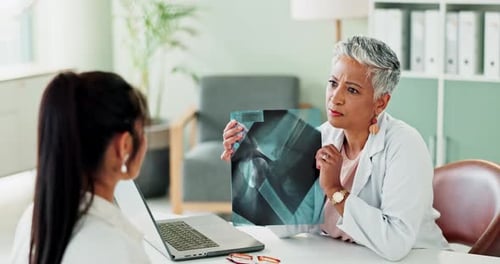 Xray, medical and doctor explaining to patient in hospital office for diagnosis or treatment