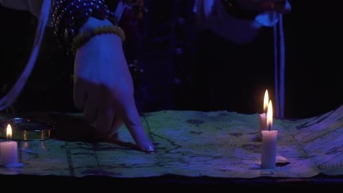 Woman Pirate Studies Map by Candlelight