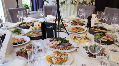 Tables with Delicious Exclusive Dishes at Wedding Banquet
