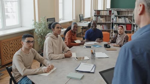 Group Of Migrants Learning Language