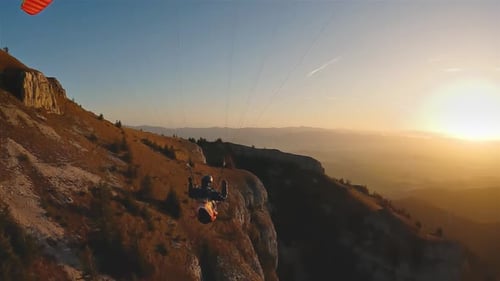 Freedom Adrenaline Flying Paragliding in Mountains at Sunrise