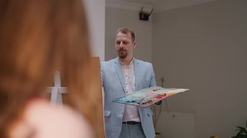 Artist with Piercing Eyes Draws Life in Studio
