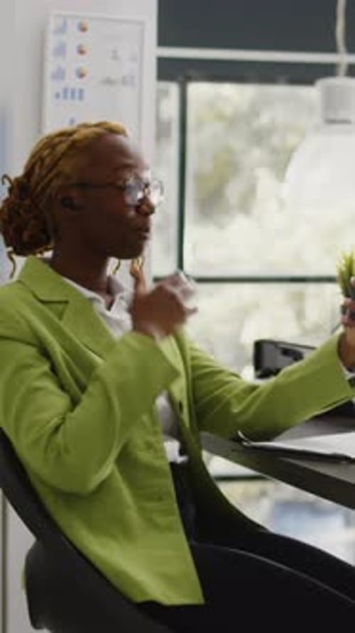 Business Woman in Office Holding Video Call