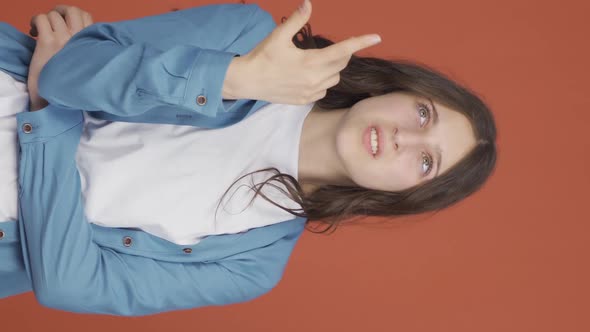 Vertical video of Hesitant young woman., People Stock Footage ft ...