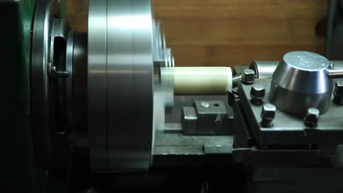 Metal Lathe Shaping White Material With Precision