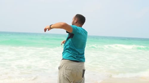 Man Exercising, Doing Warmup On Tropical Beach