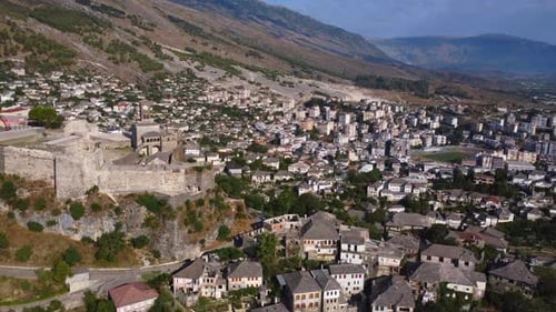 Aerial drone view of the old castle and fortress of the city of Gjirokaster or gjirokastra, Albania.