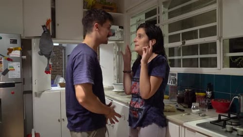 Young Couple Arguing During Tense Exchange Indoors