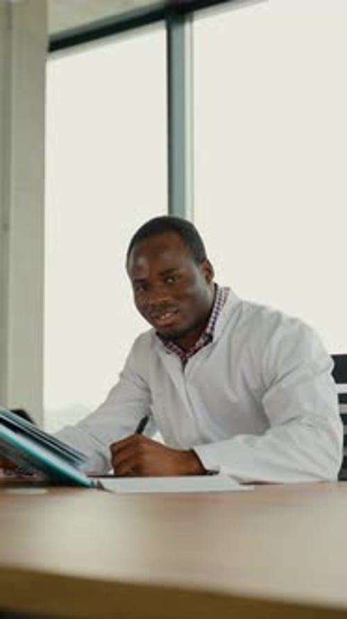 Black Guy Nursing Student Intern is Preparing for the Exam Vertical Video