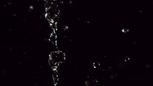 Elegant Display Of Bokeh Particles With Crystal Clear Water Droplets