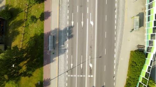 Top View Of Concrete Road With White Broken Lines, Straight Arrow, Left Arrow And Longitudinal Marki