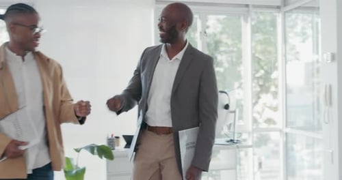 Happy, smile and business people greeting in the office while in conversation or discussion