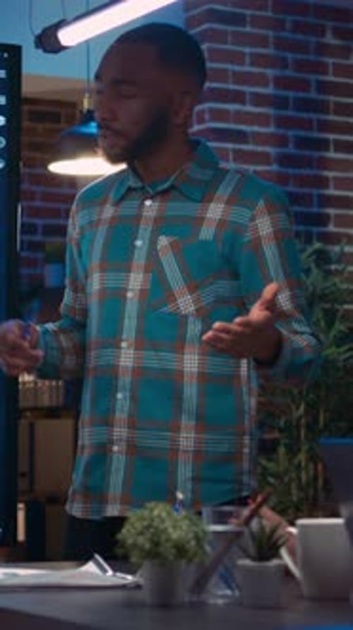 Adult Man Presenting Business Data to Coworkers