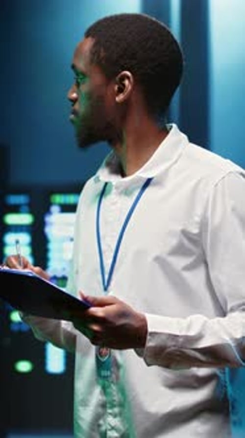 Vertical Video Computer Scientist Checking Server Racks