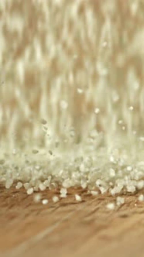 Semolina Falls on a Wooden Table Filmed on a Highspeed Camera at 1000 Fps
