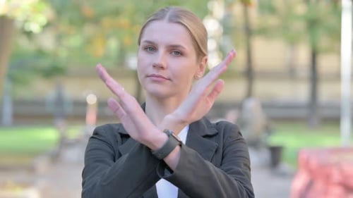 Young Woman Showing No Rejection with Arms