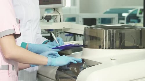 Medical Professionals Working in Laboratory Setting