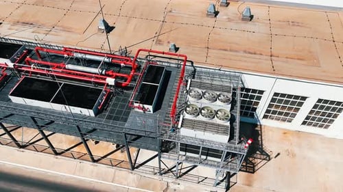 Industrial Cooling Systems on Building Roof, Aerial View