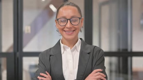 Portrait of Smiling Hispanic Business Woman in Office