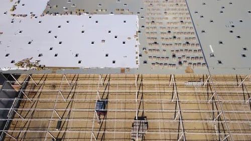 Construction Site with Steel Frame Structure of Warehouse Building Aerial View