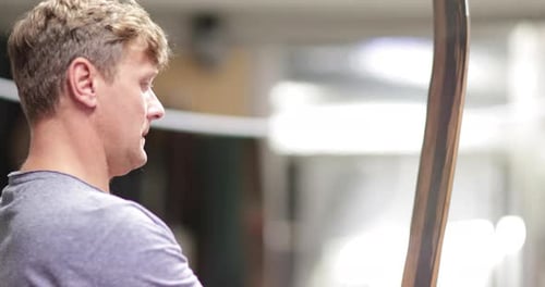 Craftsperson working in snowboard workshop