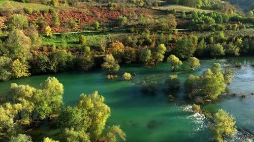 Aerial view of emerald river and autumn forest landscape. Una river, Bosnia and Herzegovina