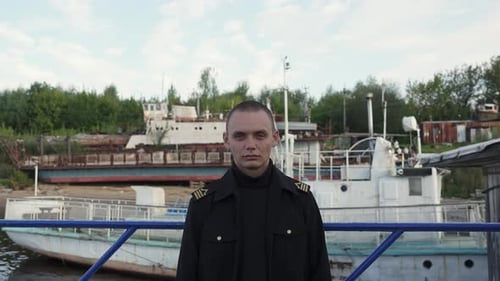 Young Male Ship Captain Standing at the River Port Clip