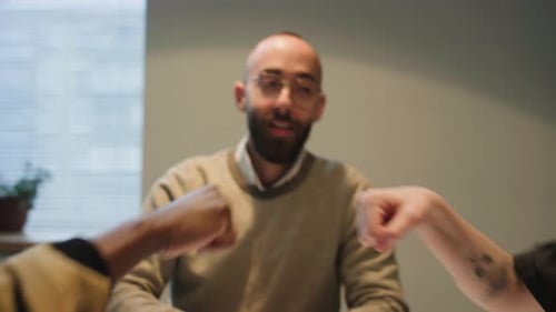 Business Colleagues Fist Bumping in Agreement