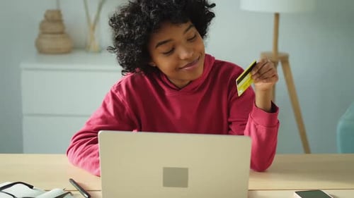Young Adult Shopping Online With Credit Card