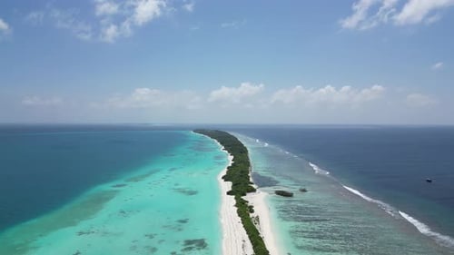 Sky blue island lagoon and tropical beach Paradise in Dhigurah, Maldives. Aerial