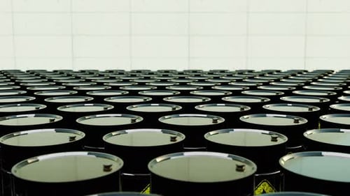 Moving Through Infinite Rows of Industrial Oil Barrels