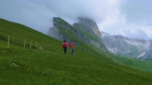Couple on Vacation Hiking in the Italien Dolomites Seceda Peak