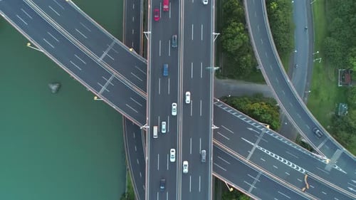 Aerial Drone View of Highway Multilevel Junction Road with Moving Cars at Sunset Active Movement of