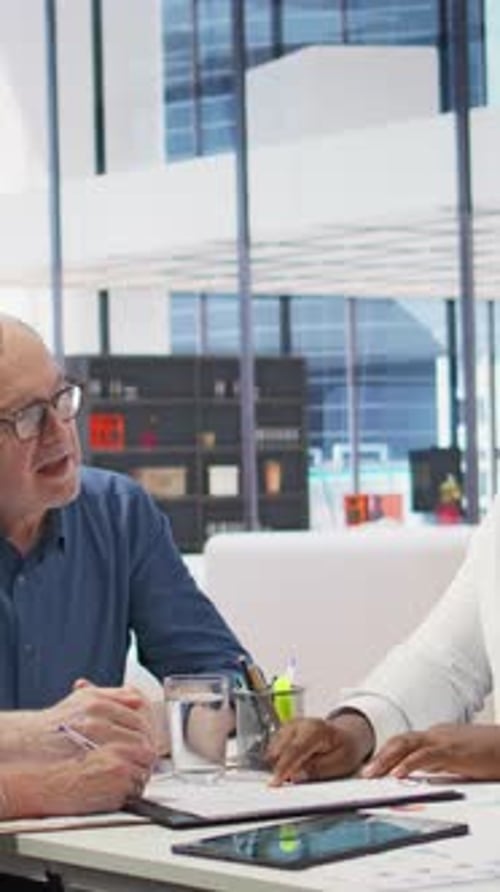 Advisors Meet with Clients in Modern Office