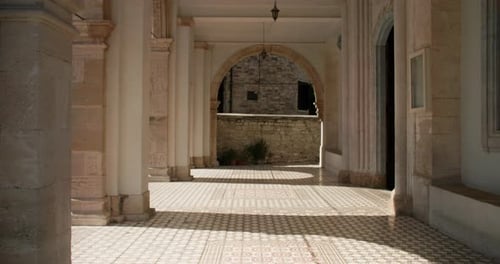 The Architecture of Ancient Streets with Columns Through Which Light Enters