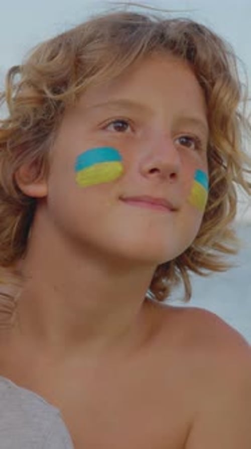Vertical Video Children of War in Ukraine Boy Refuge From Ukraine Look to the Future The Ukrainian