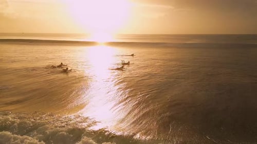 Calm Twilight Scene With Surfers Peacefully Reclining On Surfboards