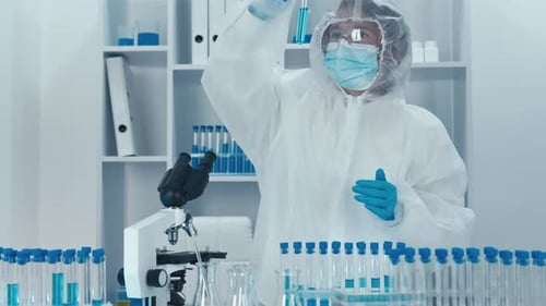 Scientist Working With Test Tubes in a Lab