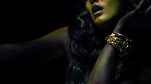 Scary Gorgona moving around with snakes in her hair, close up