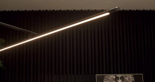 Modern Lighting Fixture with Black Slat Wall