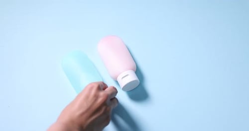 Cosmetic Bottles Display on a Blue Background