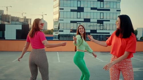 Stylish Women Celebrate with Sparklers on Rooftop